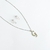 collar con aretes de inicial acero inoxidable