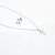 collar con aretes de inicial acero inoxidable