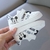 Sapatos casuais brancos Disney para bebê na internet