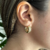 Brinco argolinha cravejada com zircônias e banhado a ouro 18K
