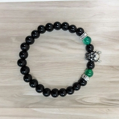 PULSERA BOLITA NEGRA Y VERDE CON DIJE Y ENGARSE DE ACERO QUIRÚRGICO