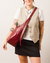 Bolsa Gota Fivela Maxi Cabernet na internet