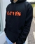 BUZO LEVIS BLACK ORANGE LETTERS