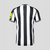 Camisa-Newcastle-I-23_24-Torcedor-Castore-Masculina-Branco-e-Preto-preta-branca-masculino-1-bruno-guimarães-Joelinton-original-comprar-premier-league-listra-listrada-listras-sela-Magpies-gola-v