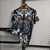 camisa-Itália-Special-Edition-Black-23_24-versace-preta-cinza-e-branca-puma-preto-branco-seleção-masculino-masculina-grego-mitologia-1-2-3-desenhos-especial-jorginho-euro-copa-2023-2024-maldini-serie-a-italiana