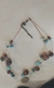 Collar de piedras azules con café
