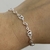 Pulsera corazón enlazado con dije calado
