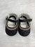 Sapato preto brilhoso