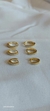 Conjunto triplo de argolas cravejadas com zircônias. - comprar online