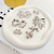 Brinco Flor Banhado a Ródio Branco - comprar online