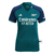 Camisa feminina do Arsenal III 2023/24 na cor verde com detalhes em azul e logo da Emirates.