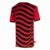 Camisa do Flamengo III 2022/23 masculina, com design listrado em vermelho e preto, logo do clube e detalhes em branco.