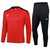Conjunto de agasalho Nike Dri-Fit, com blusa de manga longa vermelha e calça preta.