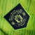 Camisa de torcedor do Manchester United III 2022/23 na cor verde limão com detalhes em preto e logotipo da equipe.