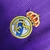 Camisa retrô do Real Madrid 2006 na cor roxa, com detalhes em branco e logotipo da equipe.