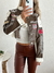 Campera importada de cuerina con bordados Tavush - comprar online