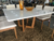 Conj Mesa de Jantar Quadrada Tampo com Vidro 4mm Off White Base em Madeira e 8 Cadeiras AKILA - ELLITE PLUS - comprar online