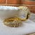 Brinco argola cravejado de zirconias dourado