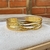 Bracelete fios cruzados dourado