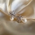 Brinco flor zirconias com pérola - comprar online