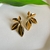 Brinco folhas dourado
