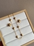 Conjunto dourado bola lisa e botão