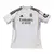 Camisa torcedor branca do Real Madrid I 25/26, fabricada pela Adidas, com logo do time e detalhes em amarelo.