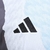 Camisa Real de Madrid Pré-jogo 25/26 - Torcedor Adidas Masculina - Branca com detalhes em laranja e preto e azul - CAMISA DE FUTEBOL | SoccerSquad Emporium