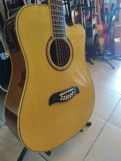 DOCEROLA OSCAR SCHMIDT OD312CE ELECTROACUSTICA CON AFINADOR NATURAL en internet
