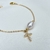 Pulseira pérola com cruz cravejada - comprar online