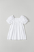 Vestido poá branco e mangas bufantes