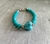 Pulseras de cristal de roca y dije de ceramica
