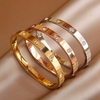 Three gold love bracelets