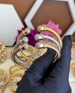 Three gold bracelets