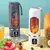 Espremedor portátil USB com frutas variadas, disponível nas cores cinza e branco.