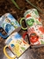 Conjunto de canecas da coleção Natalina Divertidamente, com personagens e frases temáticas de Natal.