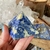 "Woman Holding Sodalite Pyramid with Clear Quartz Cluster: Crystal Healing Balance"

Our Sodalite pyramid, held delicately in a woman's hand against a backdrop of Clear Quartz clusters, is a powerful image of crystal healing balance. This captivating phot