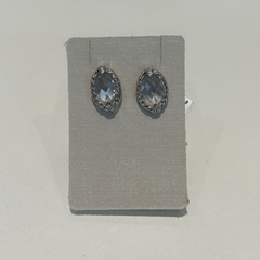 Aros de plata con dos corazones con cubics y piedra central