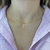 Colar choker crucifixo Ivone na internet
