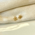 Brinco flor pequena vazada Flora - comprar online
