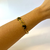 Bracelete borboletas pretas aço dourado na internet
