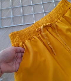 Shorts feminino tactel com bolso na frente soltinho e confortável - comprar online