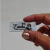 Etiqueta Couro Sintético Metalizado Prata - Retangular 4x2 cm