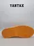 Suela de las zapatillas Air Jordan 1 Low Taxi, con un diseño en color amarillo.