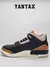 Zapatillas Jordan 3 Retro Desert Elephant en color negro y detalles en naranja y marrón