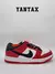 Zapatillas Nike SB Dunk Low Pro J-Pack Chicago en colores rojo, negro y blanco, vista lateral.