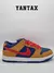 Zapatillas Nike SB Dunk Low Pro Reverse Papa Bear de color marrón, azul y rojo, con detalles de gamuza y cuero.