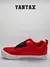 Zapatillas Vans Knu en color rojo con detalles negros, vista lateral.
