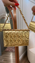 Bolsa dourada Lança Perfume