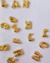 COLAR COM PINGENTE LETRAS BANHADO A OURO 18K - comprar online